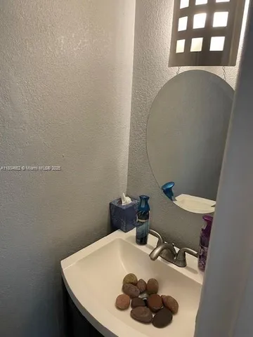 a bathroom with a sink and toilet