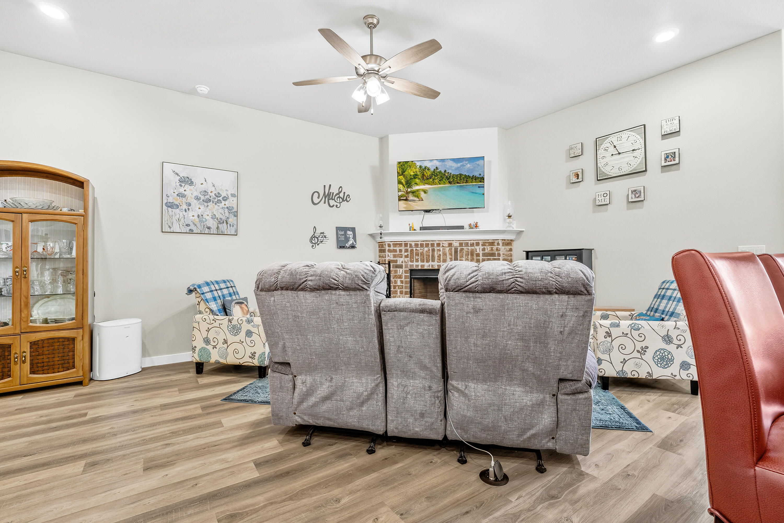 7231 29th Street Lubbock, TX 79407 - Photo 11 of 23 a living room with furniture and a wooden floor
