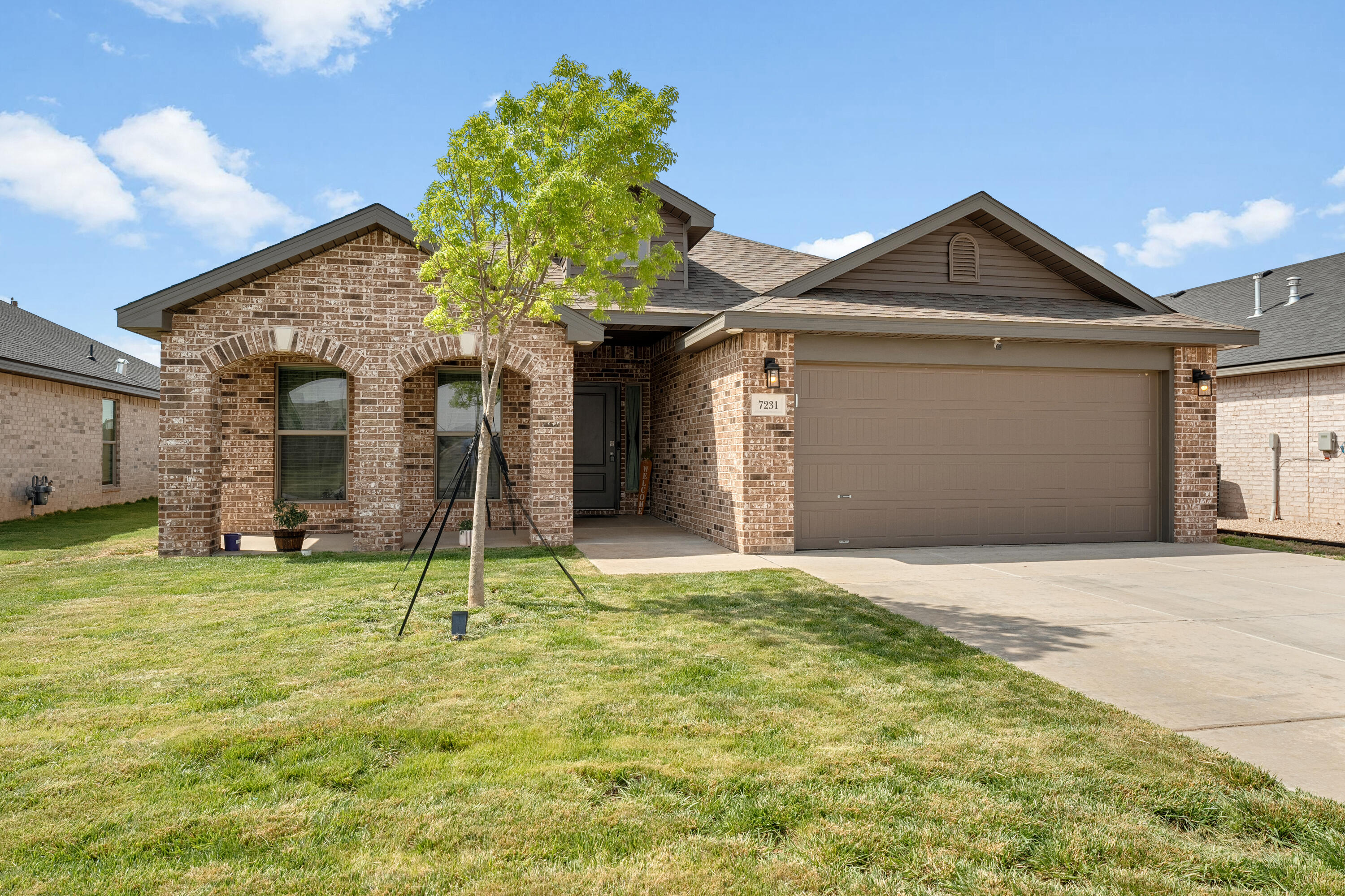 7231 29th Street Lubbock, TX 79407 - Photo 23 of 23 a front view of a house with a yard
