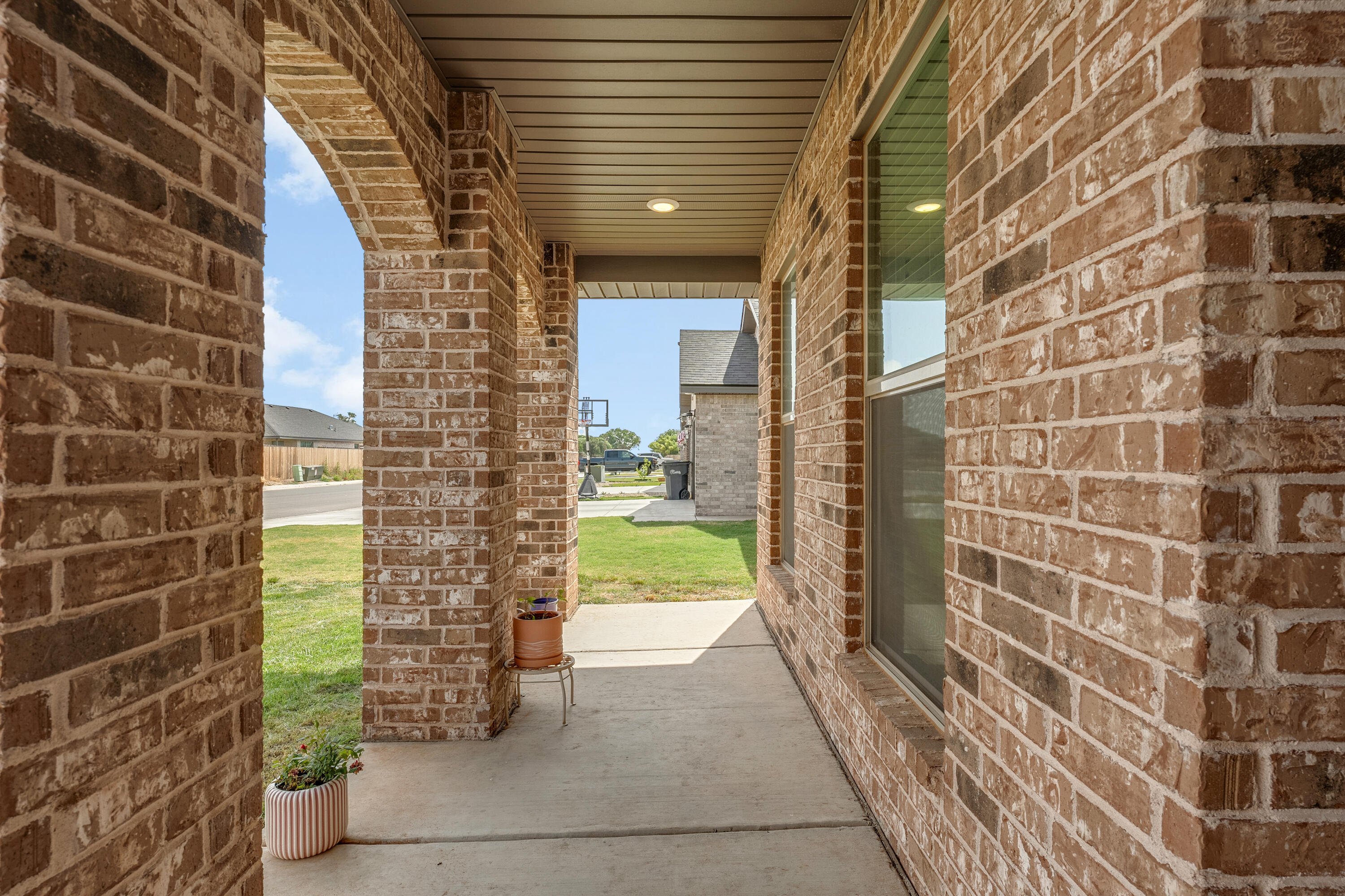 7231 29th Street Lubbock, TX 79407 - Photo 3 of 23 a view of a pathway both side of building