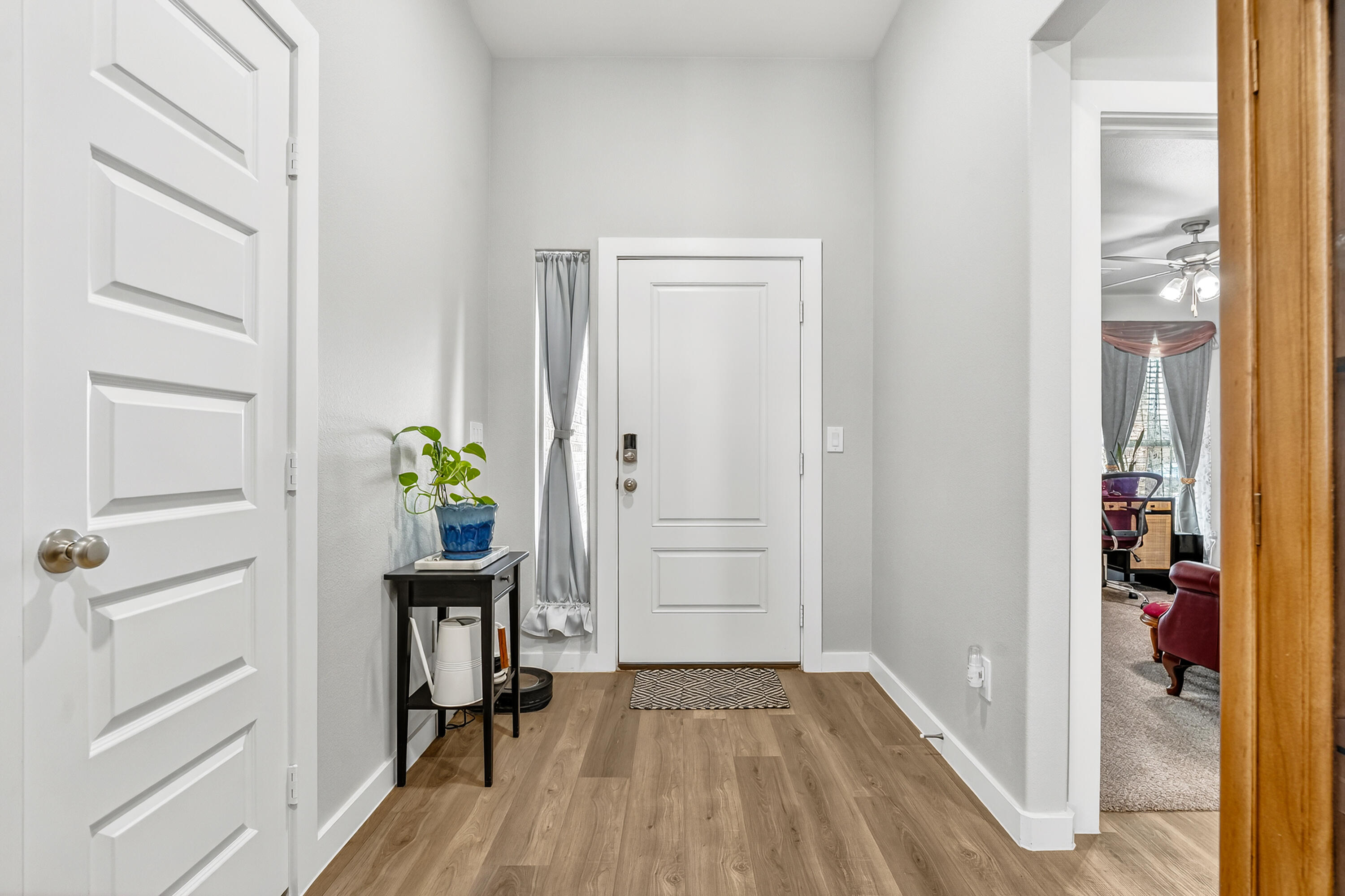 7231 29th Street Lubbock, TX 79407 - Photo 4 of 23 a view of a hallway with wooden floor and closet