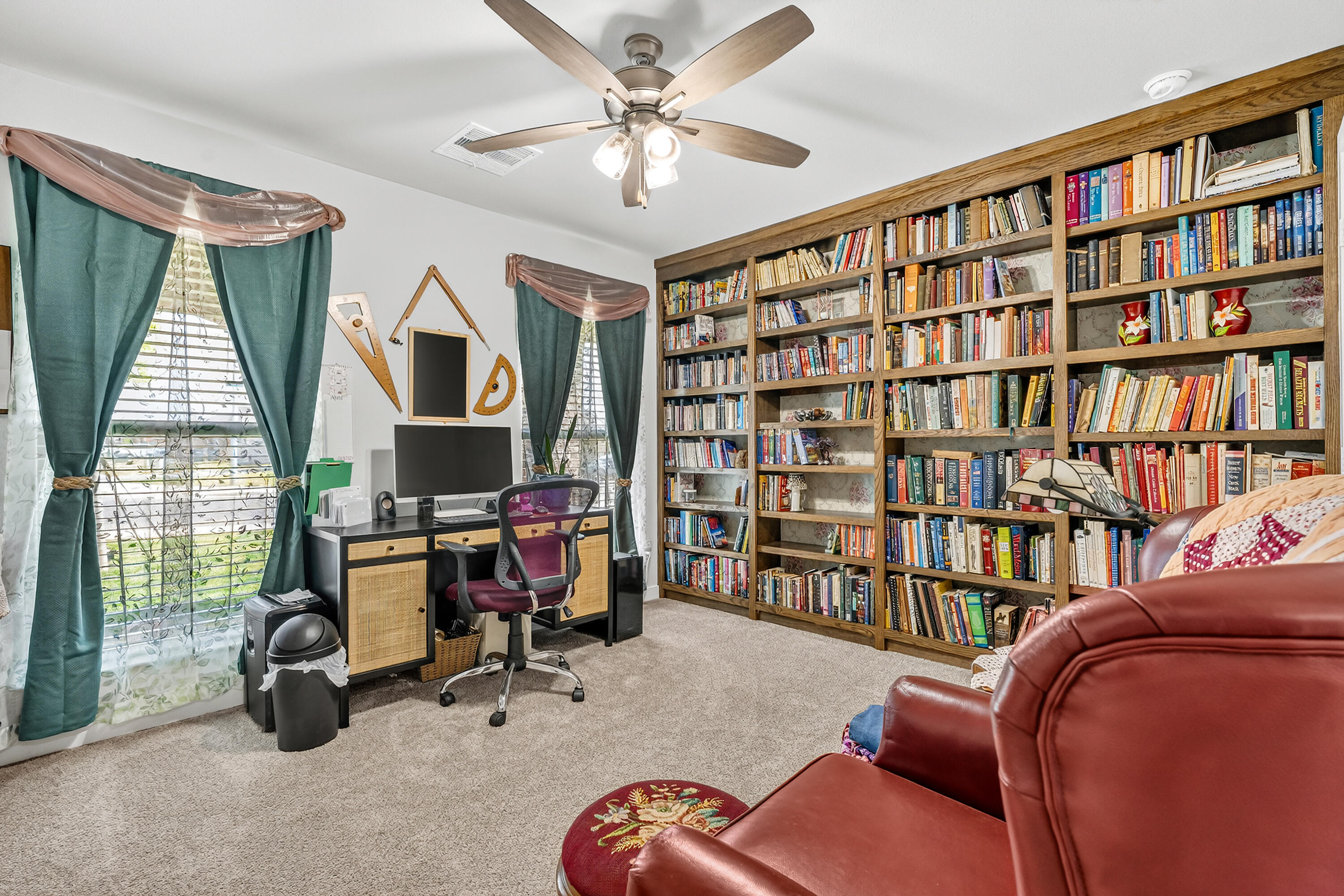 7231 29th Street Lubbock, TX 79407 - Photo 5 of 23 a view of a livingroom with furniture and a book shelf