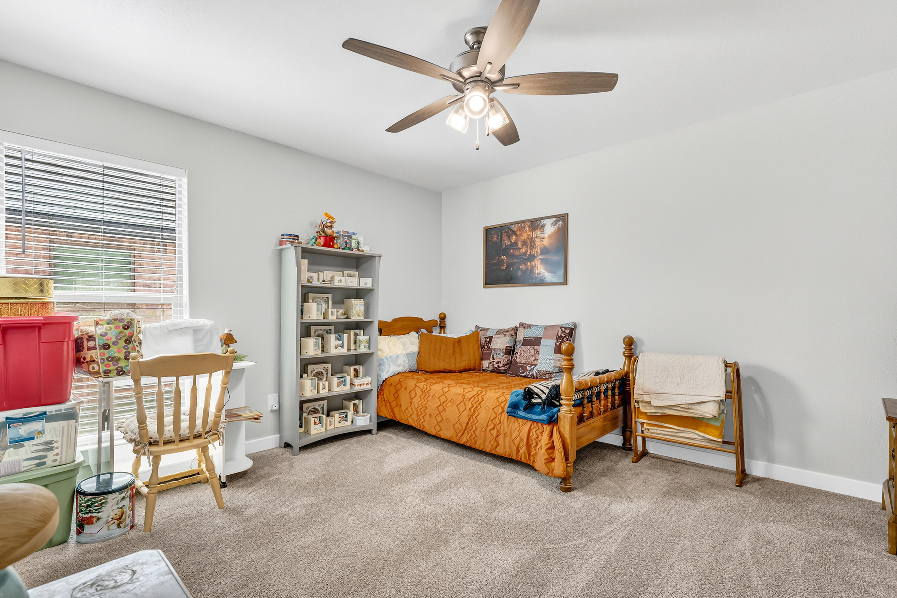 7231 29th Street Lubbock, TX 79407 - Photo 8 of 23 a living room with furniture and a book shelf