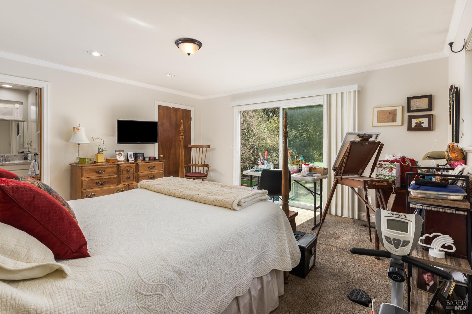 5960 Yerba Buena Road Santa Rosa, CA 95409 - Photo 11 of 17 a bedroom with a bed and large windows