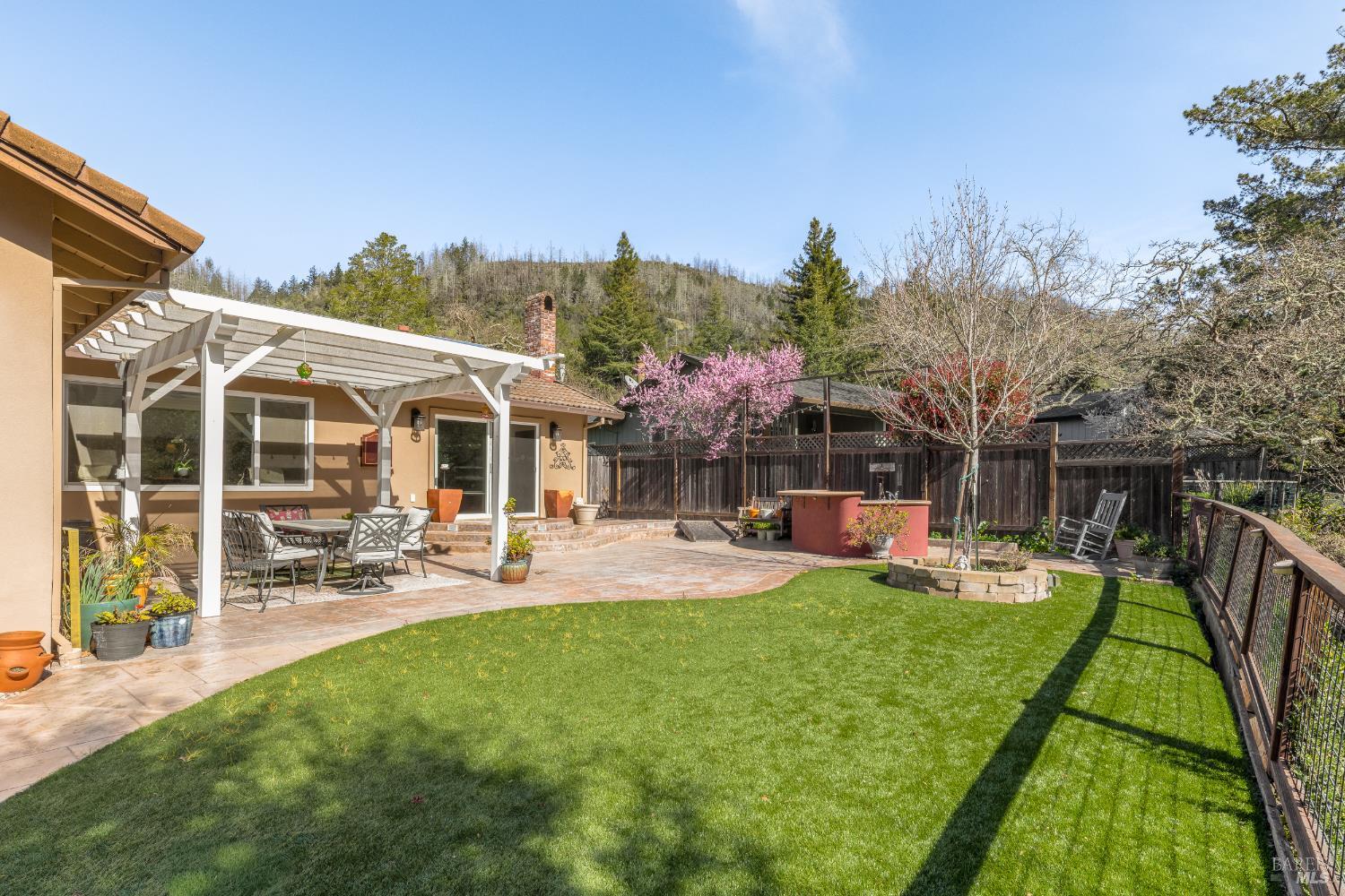 5960 Yerba Buena Road Santa Rosa, CA 95409 - Photo 14 of 17 a view of a house with backyard porch and sitting area