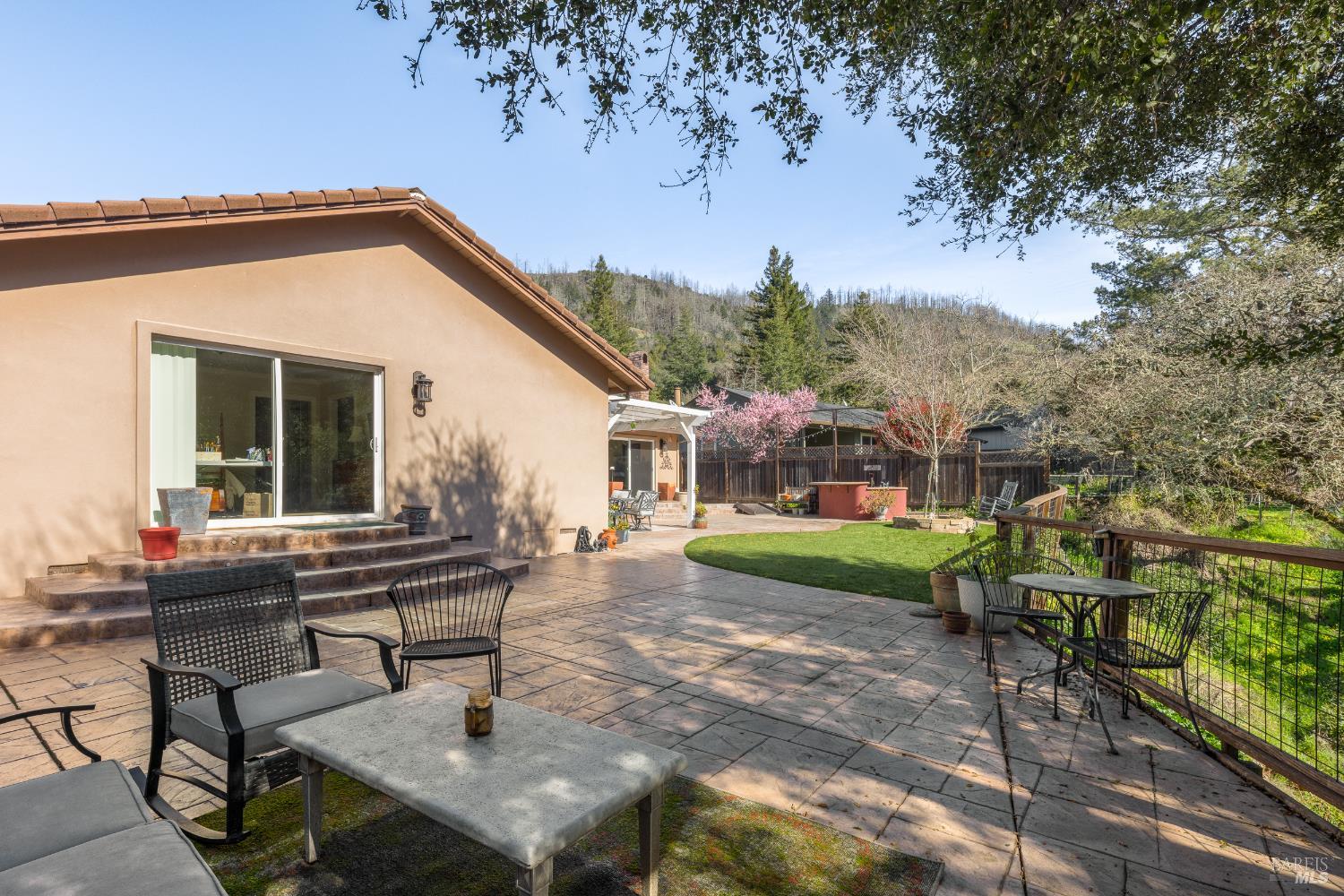 5960 Yerba Buena Road Santa Rosa, CA 95409 - Photo 15 of 17 a view of house with backyard and outdoor seating