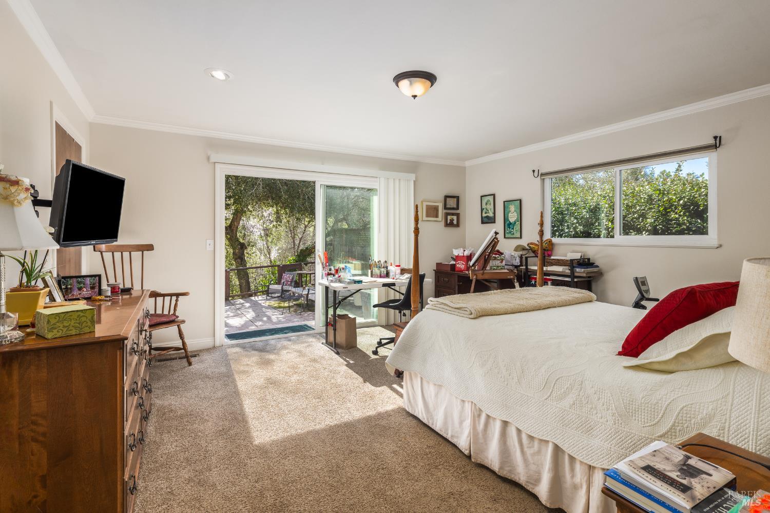 5960 Yerba Buena Road Santa Rosa, CA 95409 - Photo 10 of 17 a bed room with a bed television and a large window