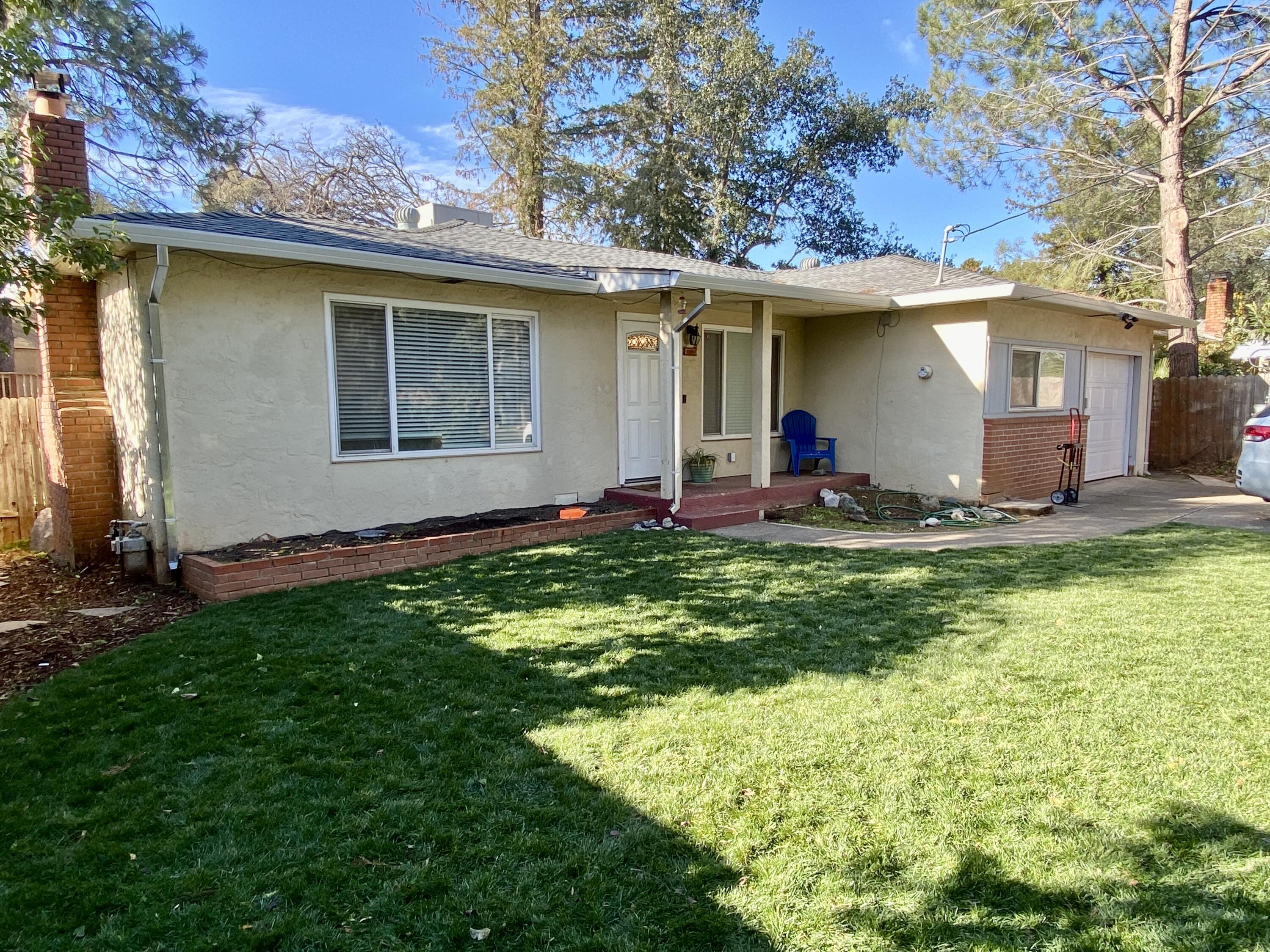 2890 Irwin Road Redding, CA 96002 - Photo 1 of 28 a front view of house with yard and seating area