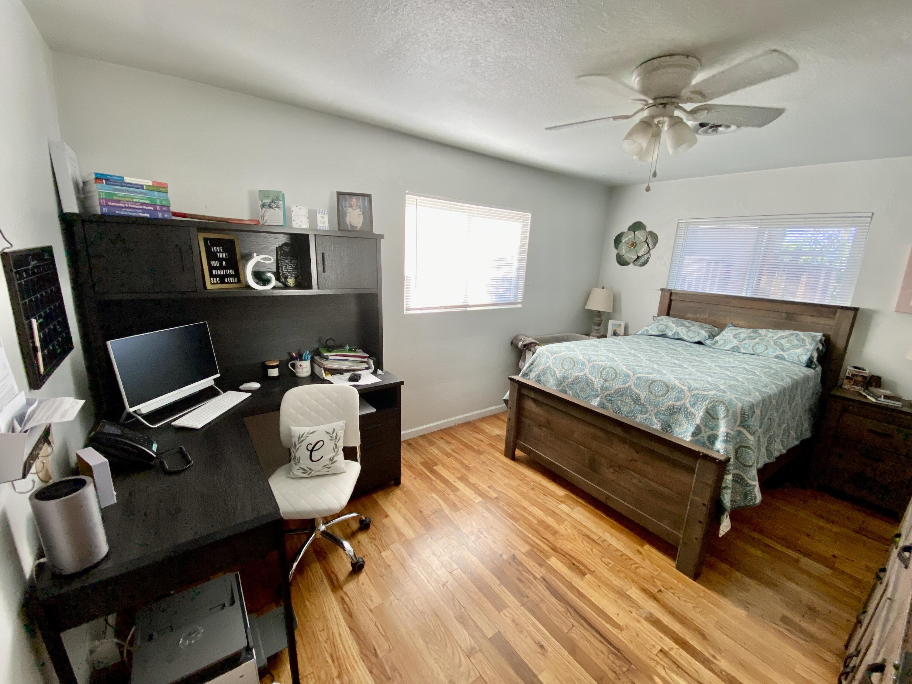 2890 Irwin Road Redding, CA 96002 - Photo 13 of 28 a bedroom with a bed window and a desk