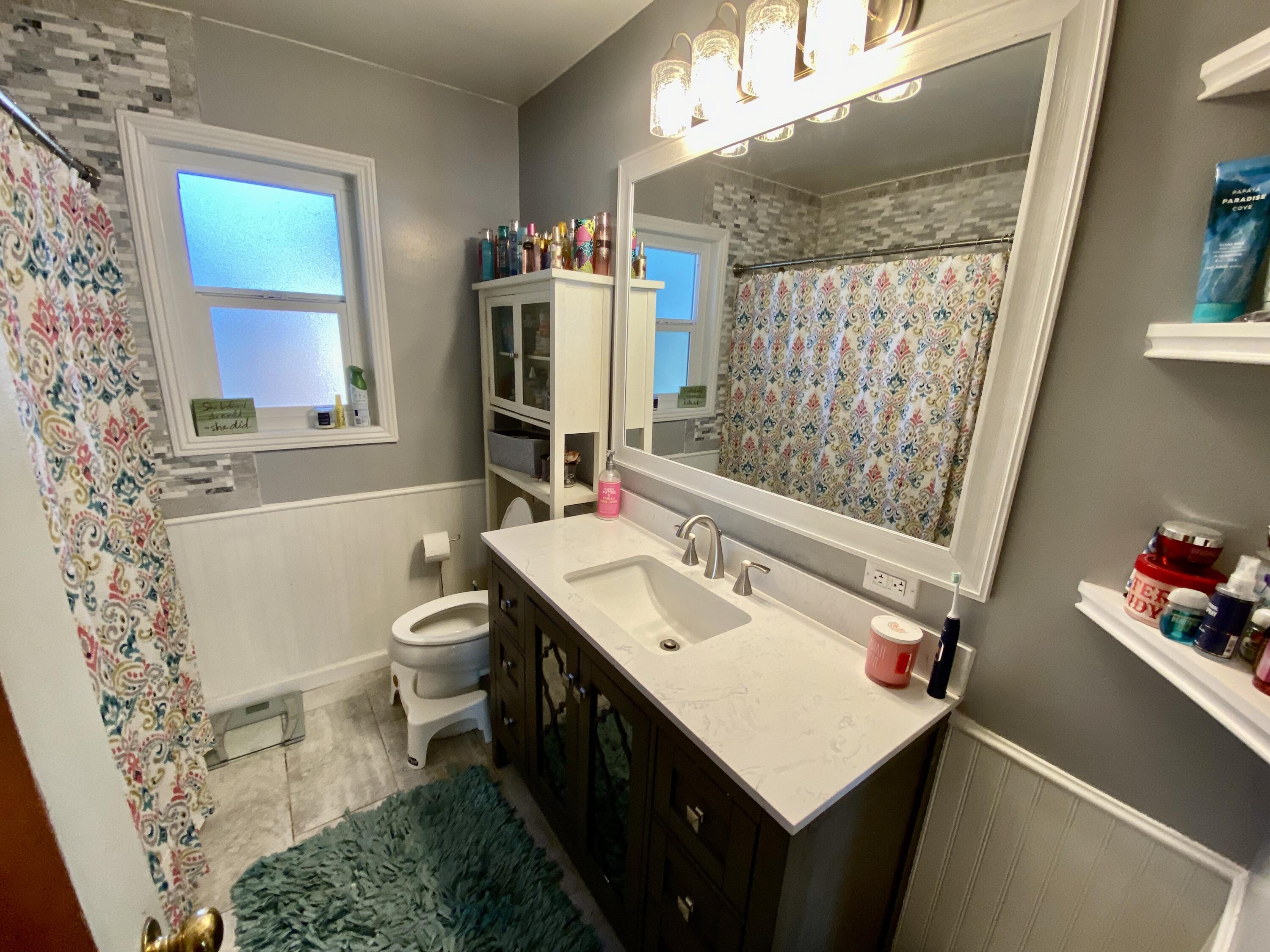 2890 Irwin Road Redding, CA 96002 - Photo 16 of 28 a bathroom with a sink toilet and shower