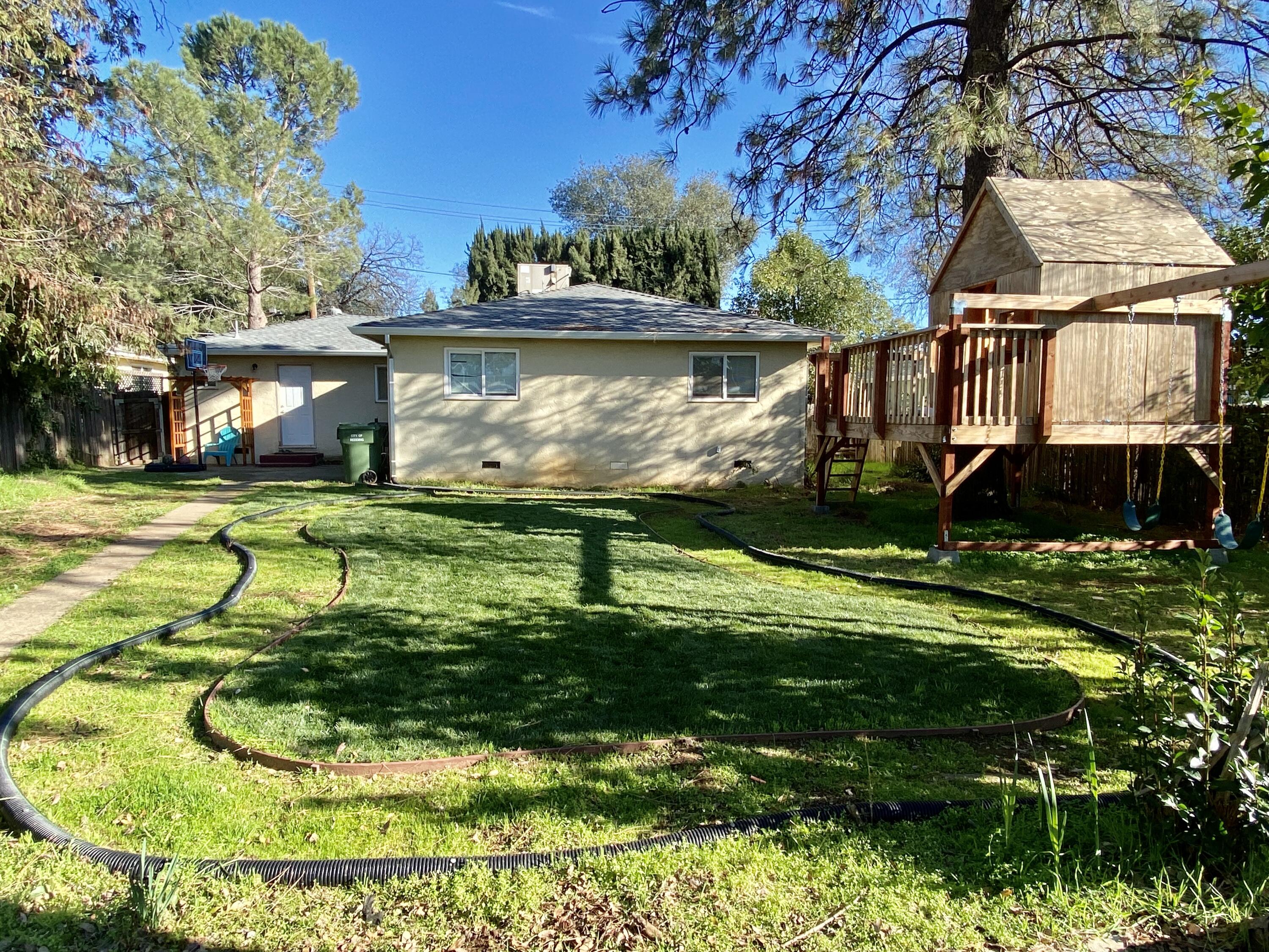 2890 Irwin Road Redding, CA 96002 - Photo 24 of 28 a view of a swimming pool with a yard