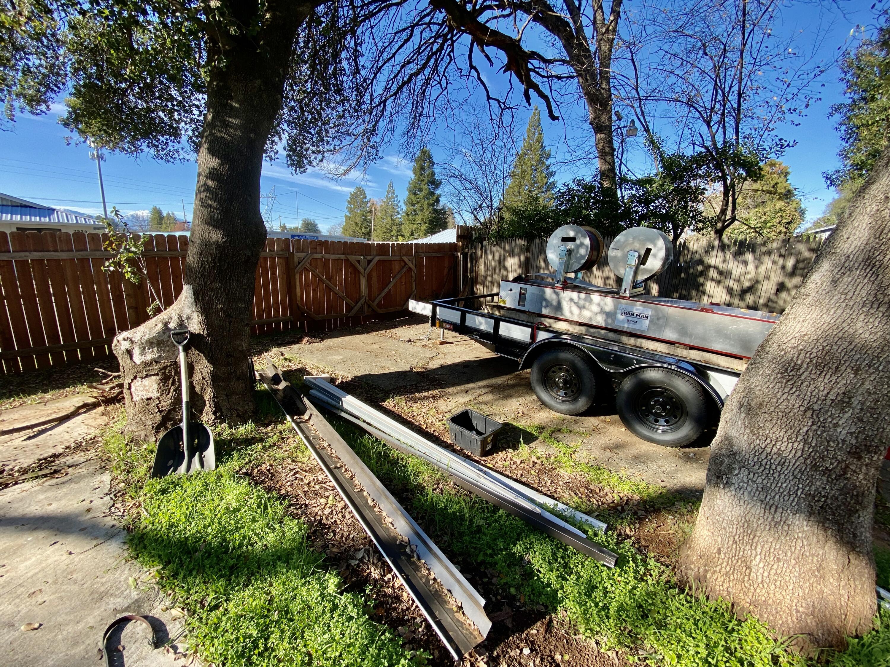 2890 Irwin Road Redding, CA 96002 - Photo 27 of 28 a view of a backyard with plants and a patio