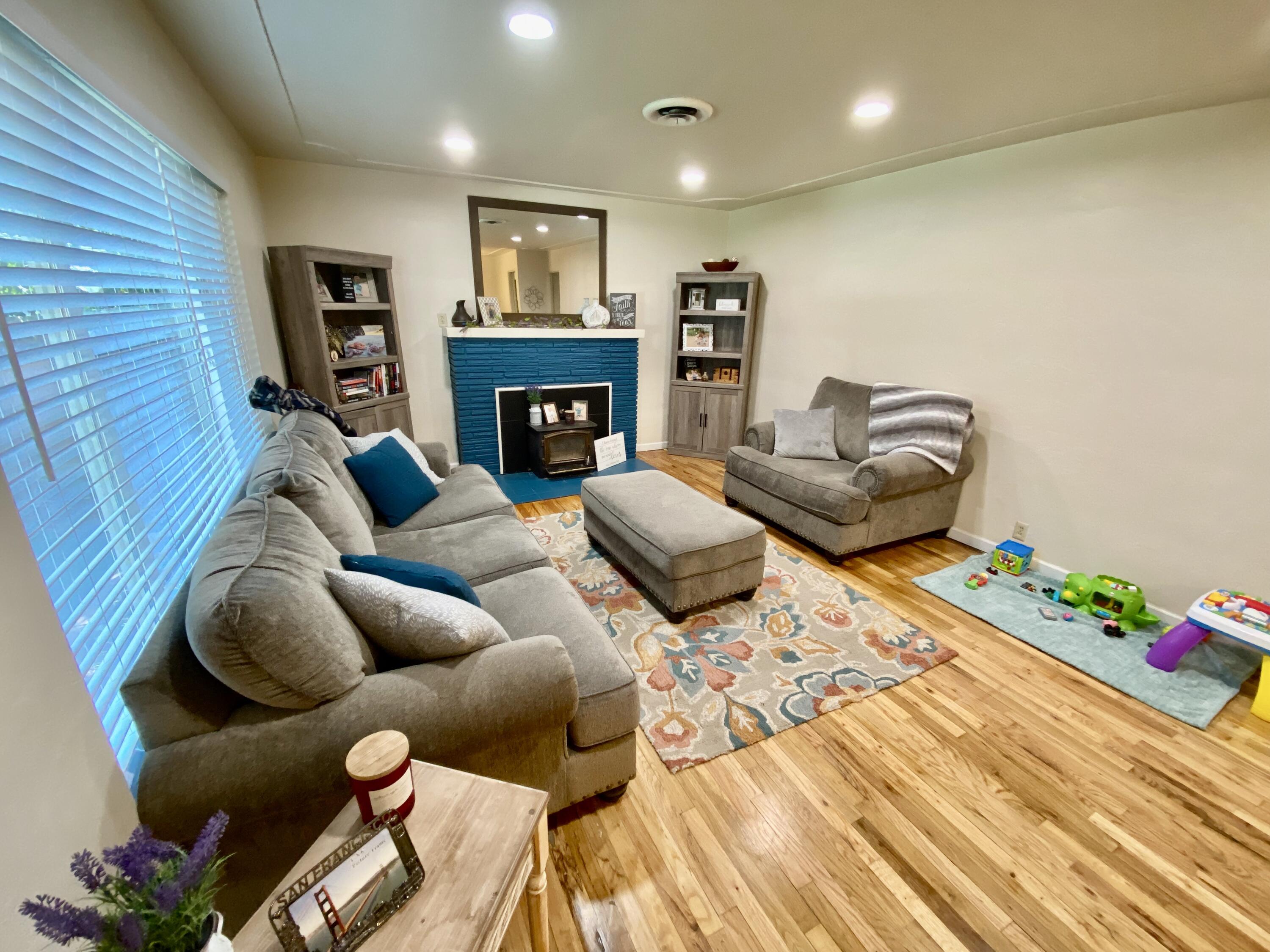 2890 Irwin Road Redding, CA 96002 - Photo 4 of 28 a living room with furniture and a fireplace