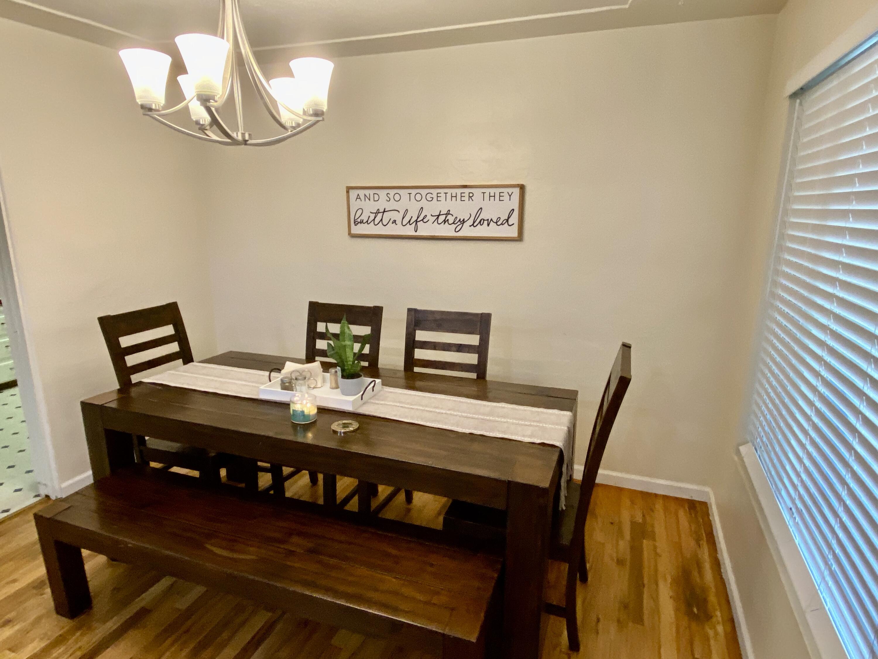 2890 Irwin Road Redding, CA 96002 - Photo 6 of 28 a view of a dining room with furniture and wooden floor