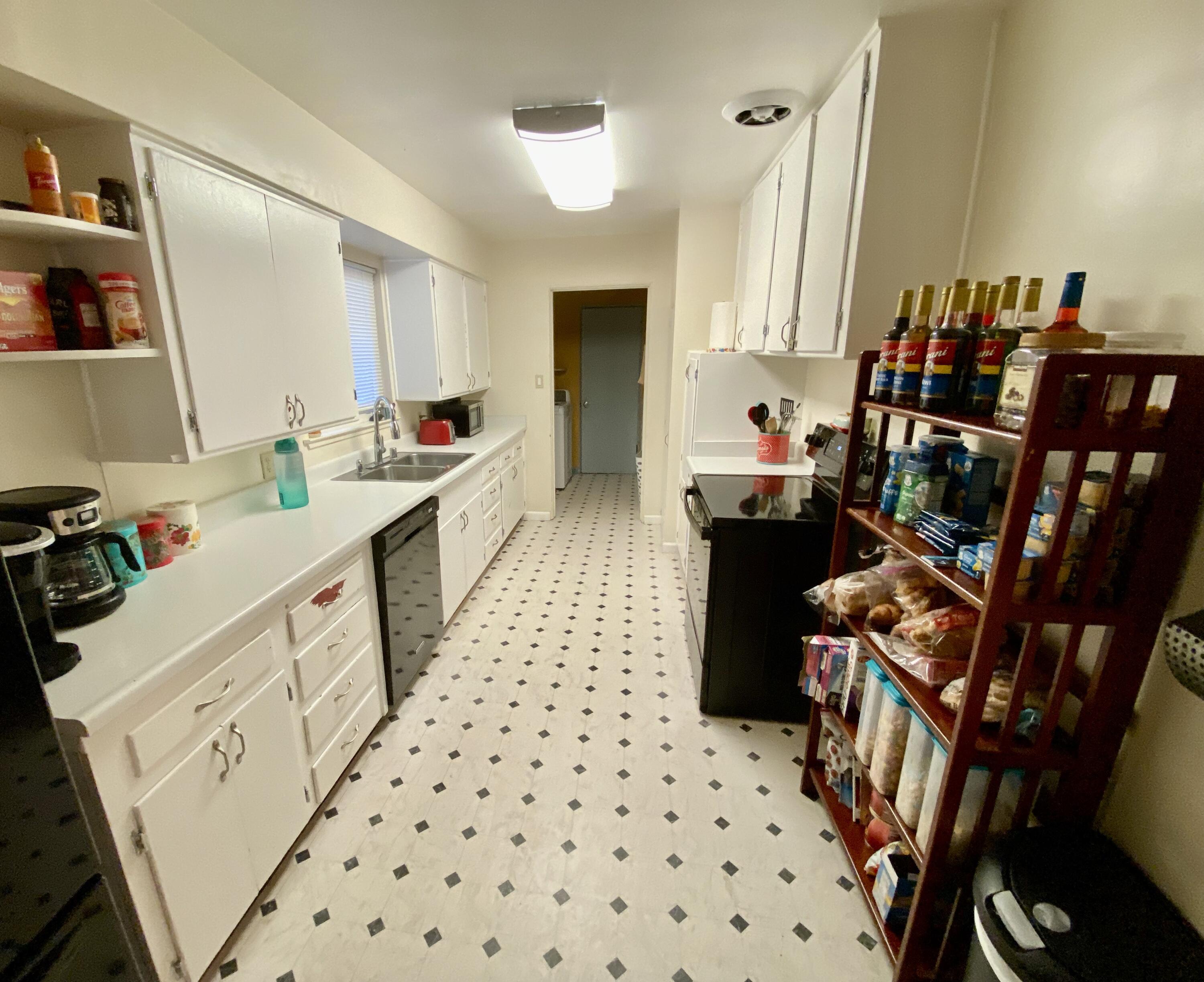 2890 Irwin Road Redding, CA 96002 - Photo 9 of 28 a kitchen with a sink and cabinets