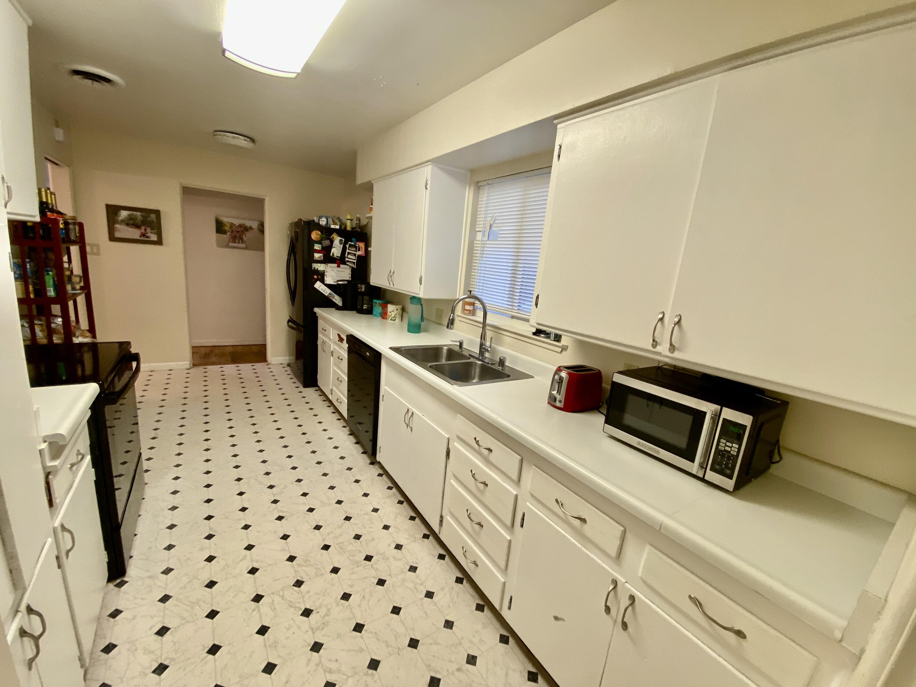 2890 Irwin Road Redding, CA 96002 - Photo 10 of 28 a kitchen with stainless steel appliances a refrigerator and a sink