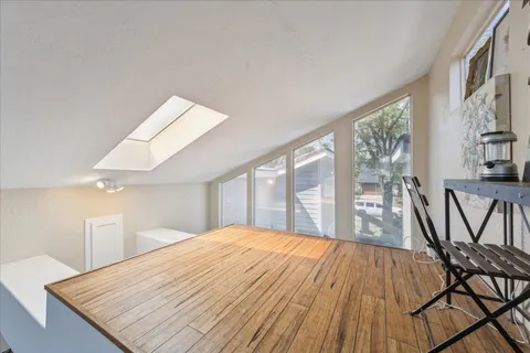 a bedroom with a bed and a table