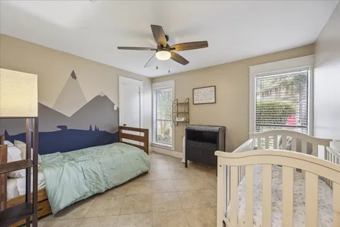 a bedroom with furniture and a window