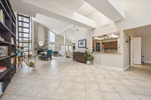a view of living room with stainless steel appliances cabinets