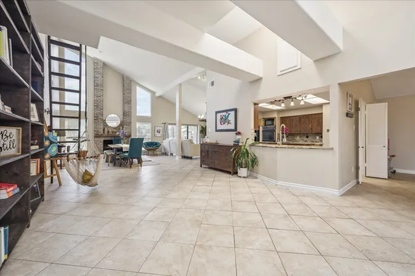 a view of living room with stainless steel appliances cabinets