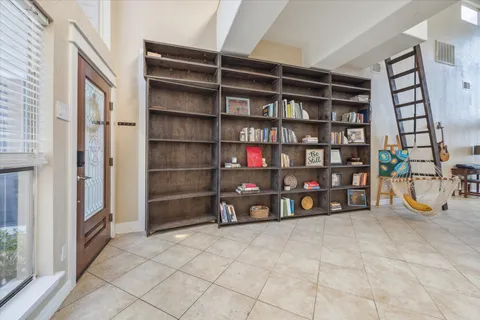 a view of an empty room with empty shelves