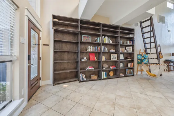 a view of an empty room with empty shelves