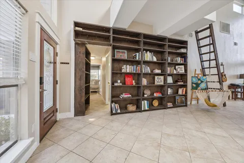 a view of an empty room with shelves