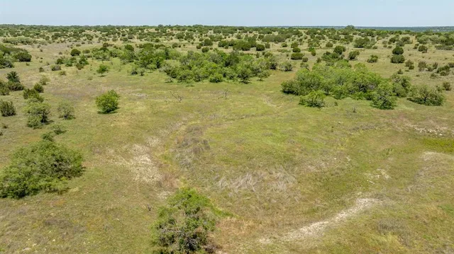 a view of a field with an outdoor space
