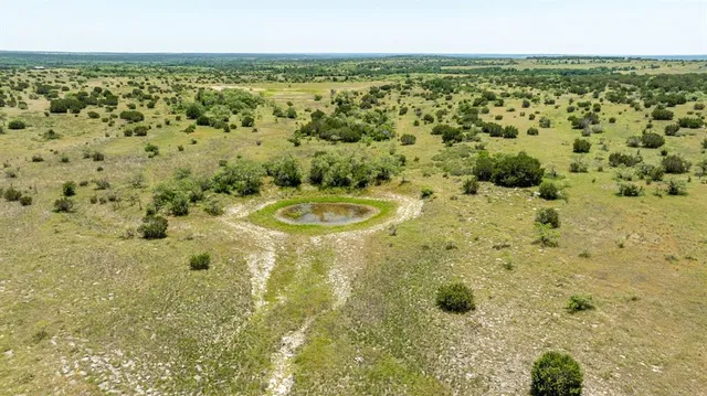 a bathroom with a toilet sink and shower