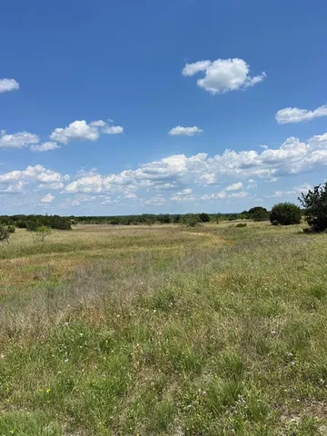 a view of an ocean and a mountain
