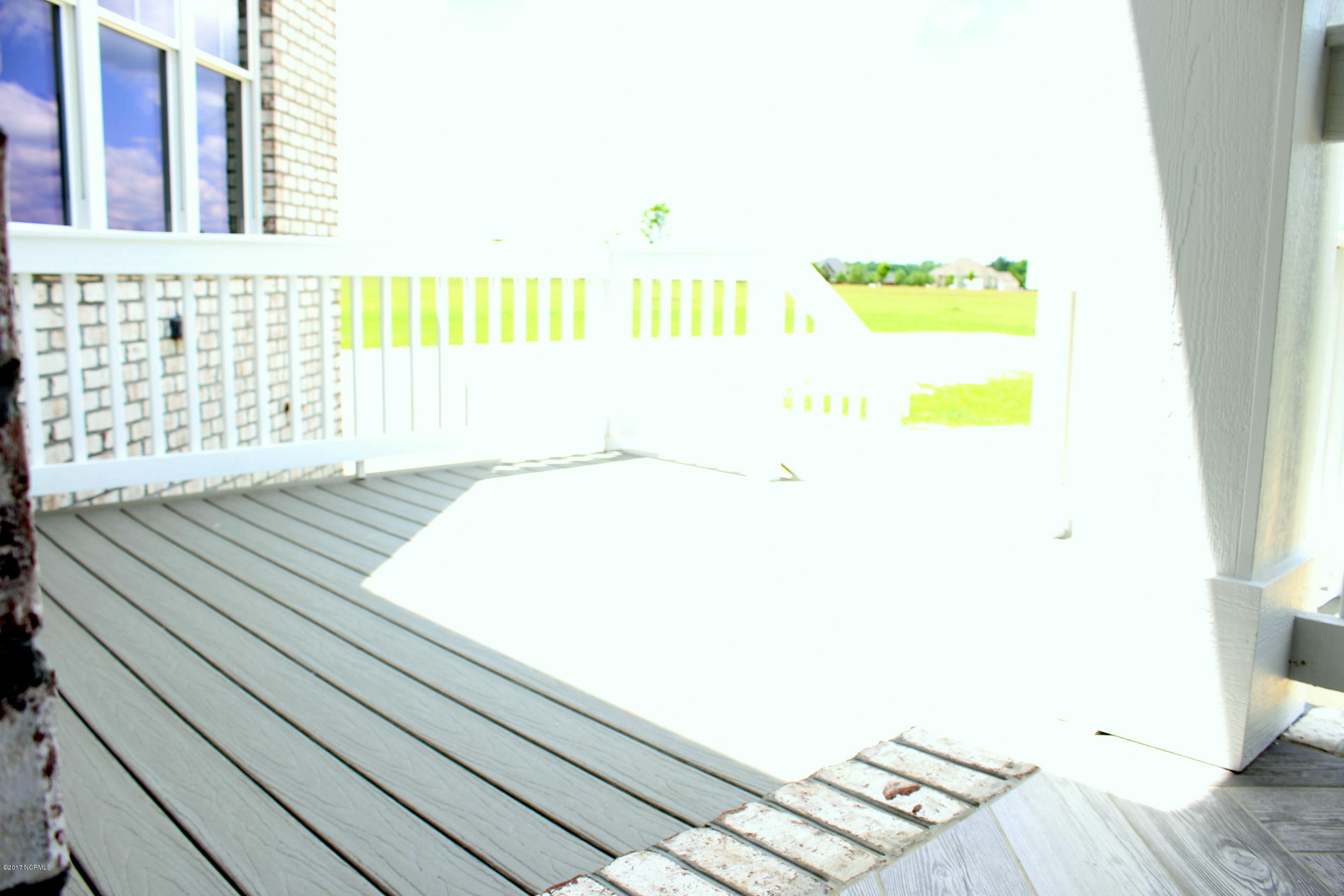 3747 Mobleys Bridge Road Grimesland, NC 27837 - Photo 60 of 86 step down to deck
