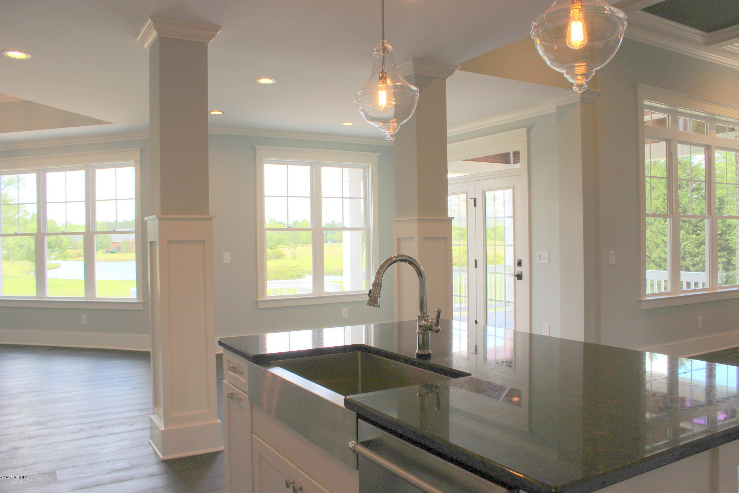 3747 Mobleys Bridge Road Grimesland, NC 27837 - Photo 9 of 86 kitchen island , stainless sink and appliances