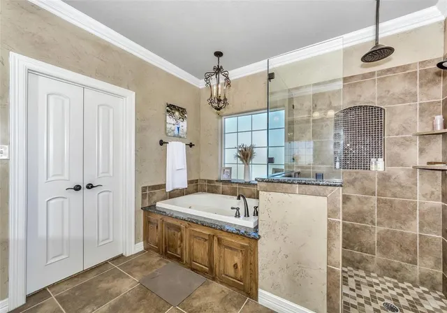 a bathroom with a tub and a shower