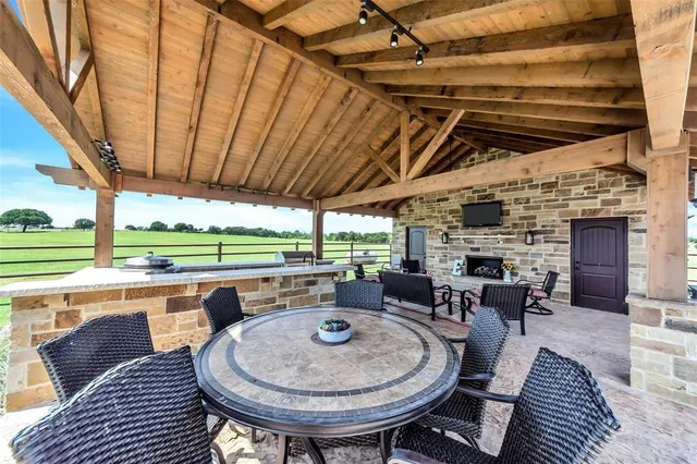 a view of a backyard with sitting area