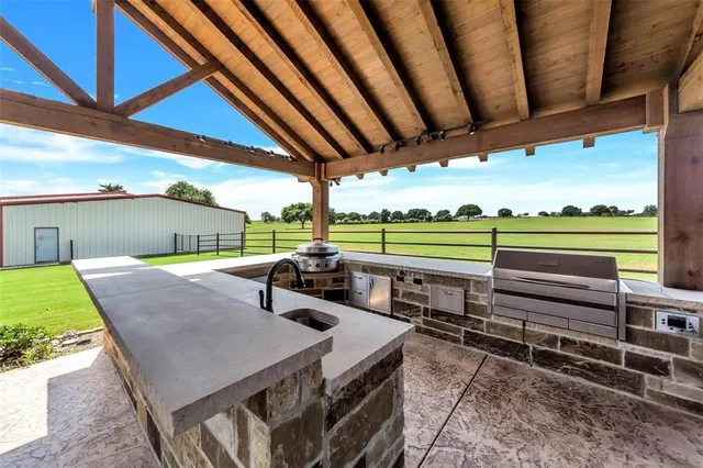 a balcony with furniture and a garden