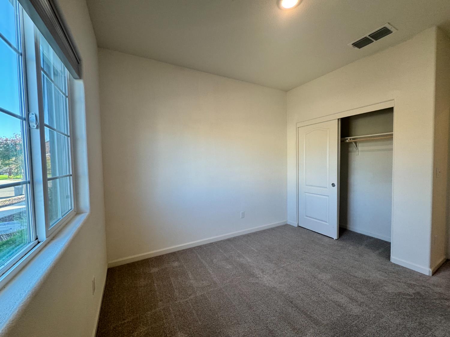 4271 Freemark Avenue Merced, CA 95348 - Photo 15 of 37 a view of an empty room with a window