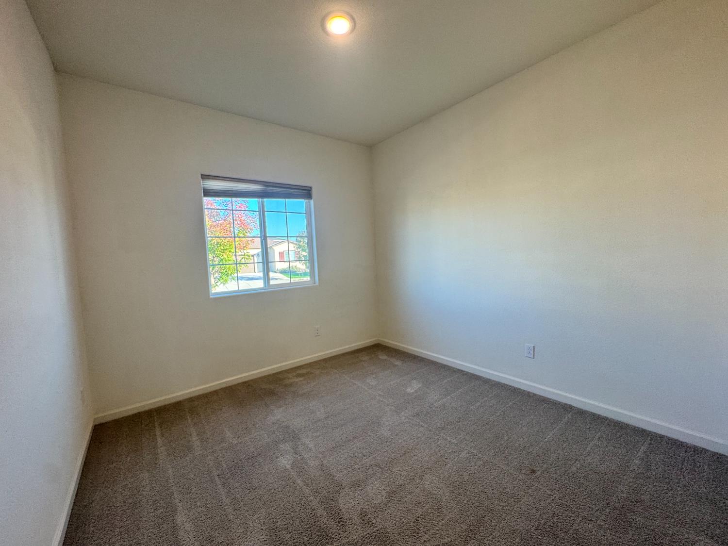 4271 Freemark Avenue Merced, CA 95348 - Photo 16 of 37 an empty room with a window