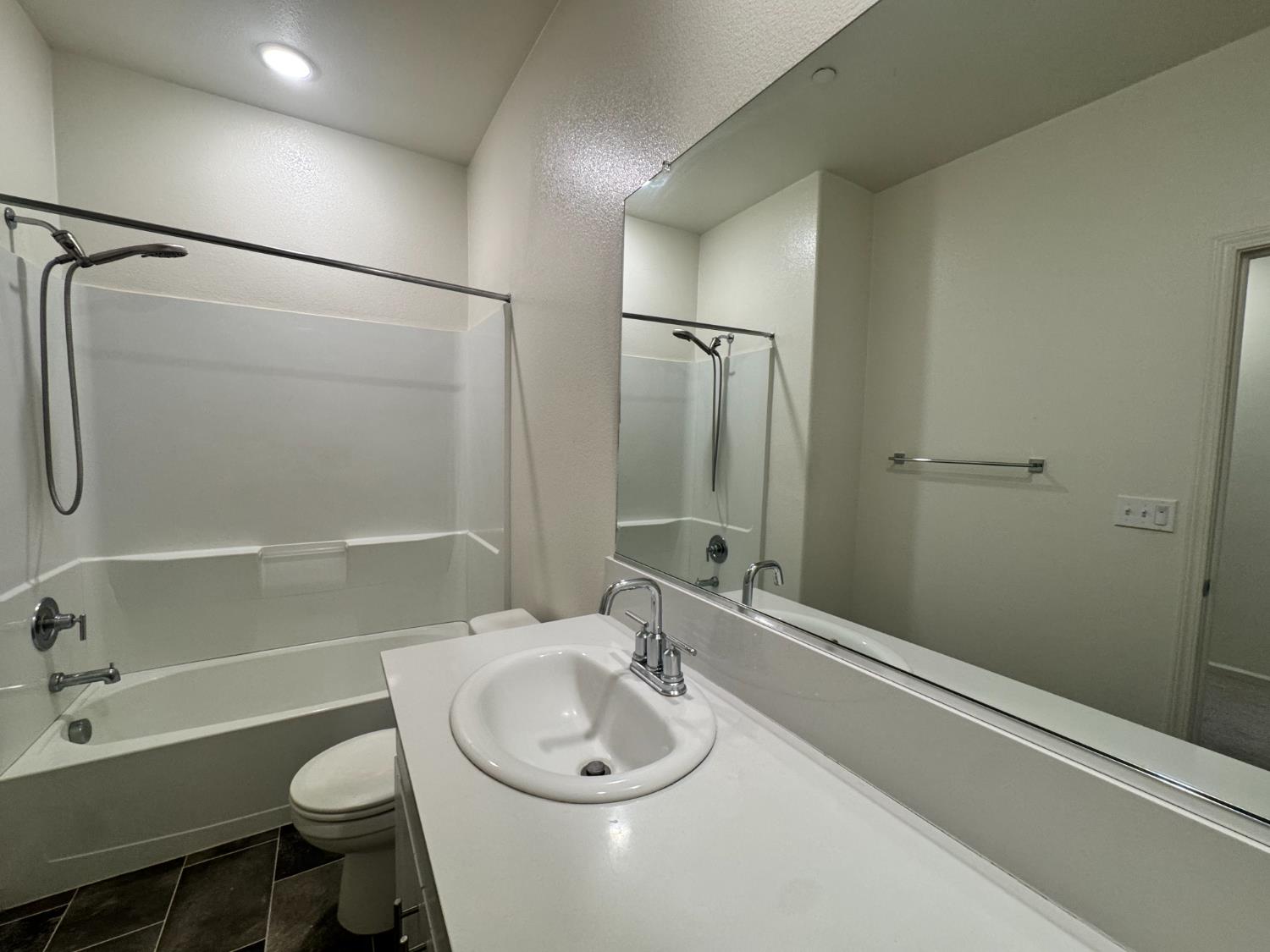 4271 Freemark Avenue Merced, CA 95348 - Photo 18 of 37 a bathroom with a sink a toilet and shower