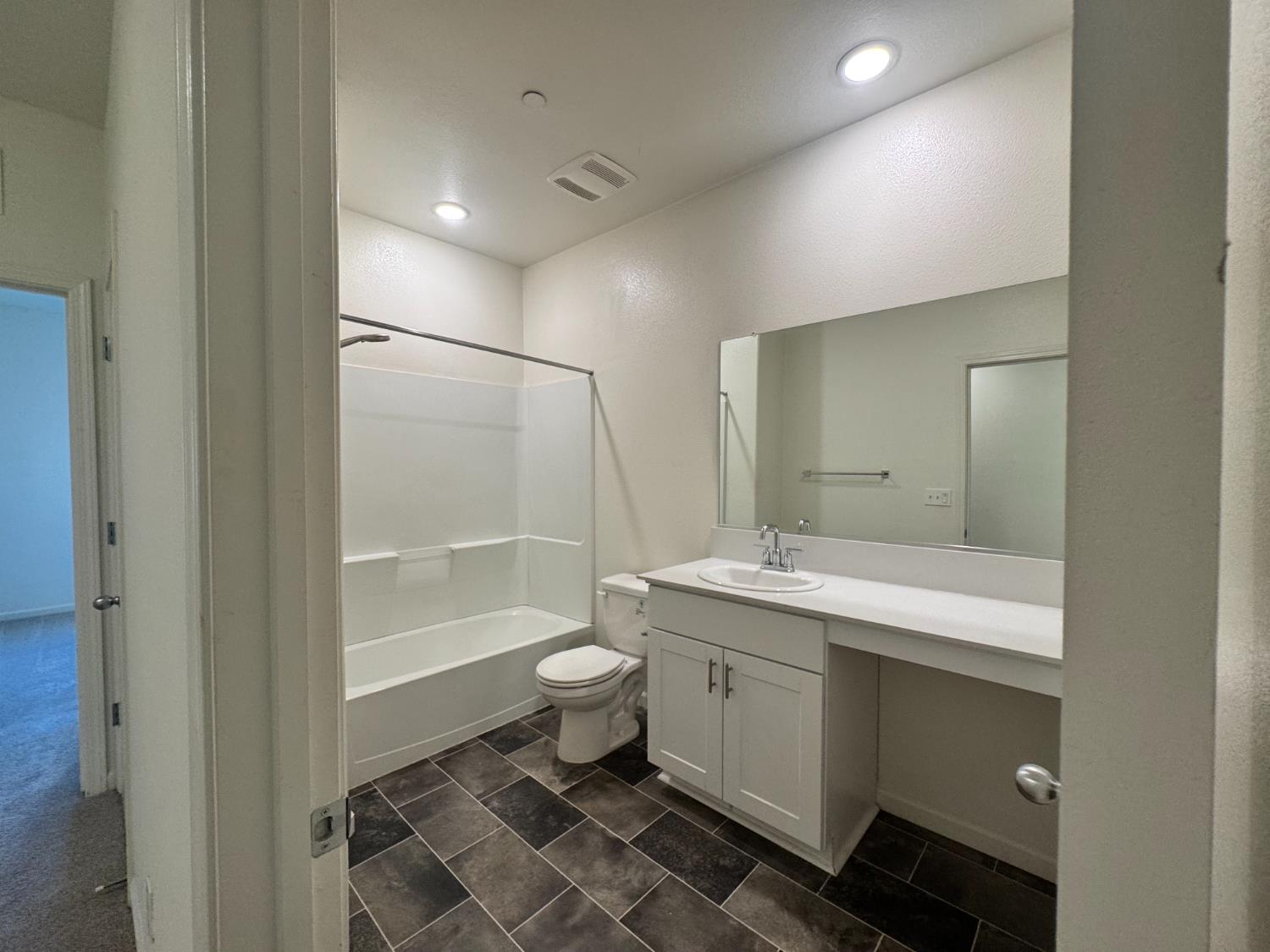 4271 Freemark Avenue Merced, CA 95348 - Photo 19 of 37 a bathroom with a sink toilet a mirror and shower