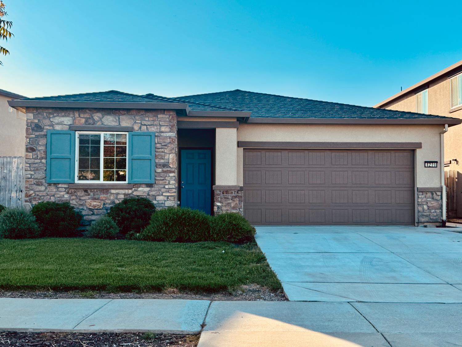 4271 Freemark Avenue Merced, CA 95348 - Photo 2 of 37 a front view of a house with garden