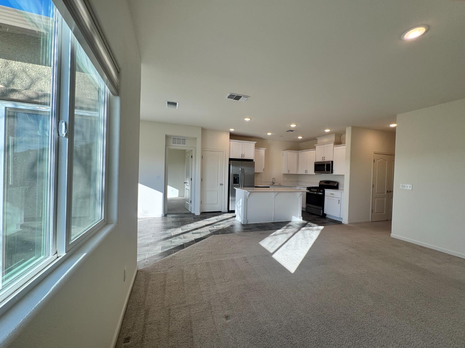 4271 Freemark Avenue Merced, CA 95348 - Photo 34 of 37 a view of a kitchen with kitchen island a counter top space and stainless steel appliances