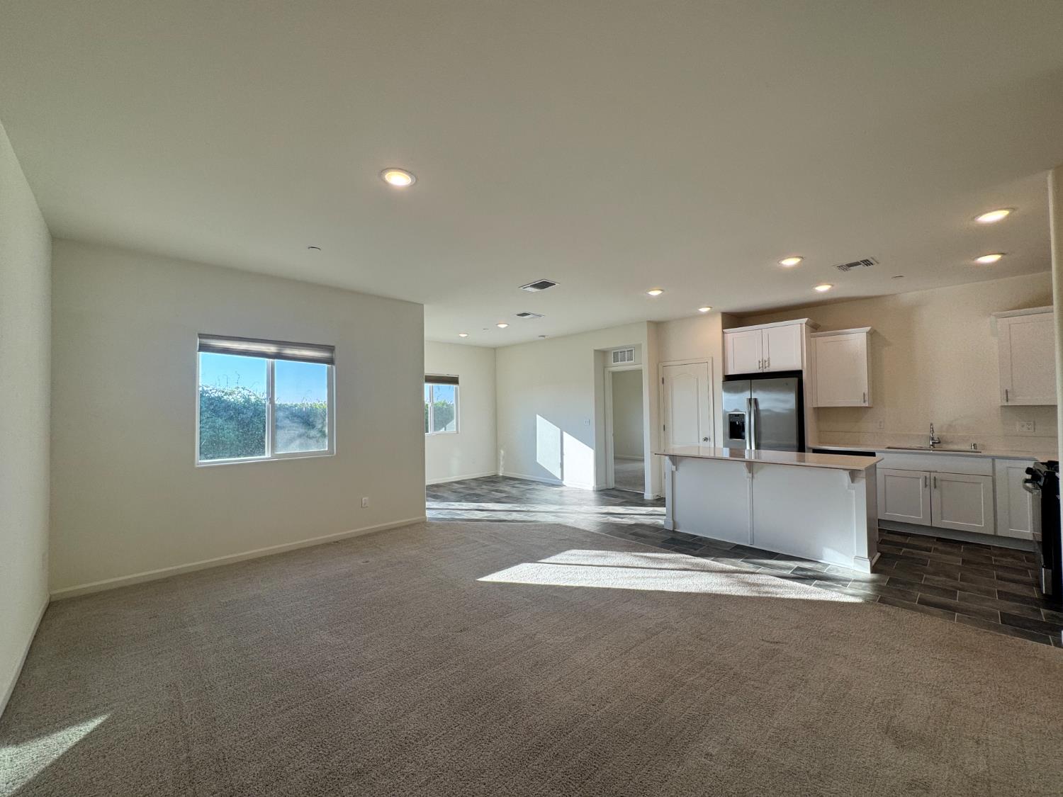 4271 Freemark Avenue Merced, CA 95348 - Photo 36 of 37 a view of kitchen with kitchen island white cabinets and counter space