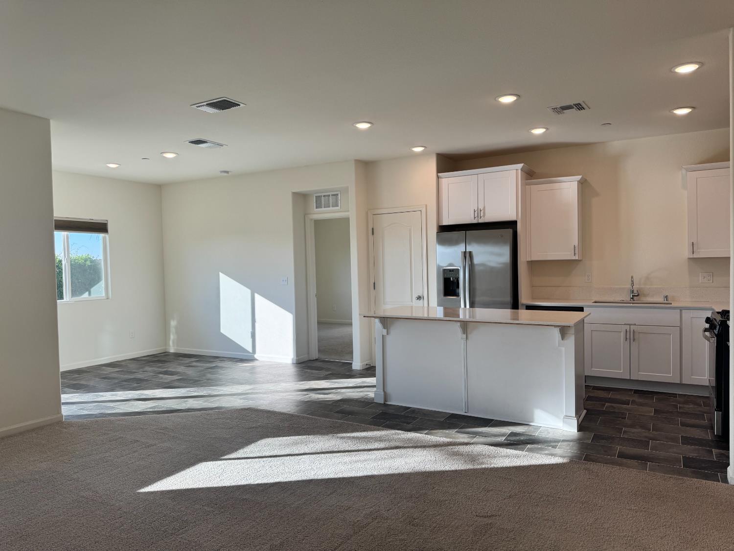 4271 Freemark Avenue Merced, CA 95348 - Photo 37 of 37 a kitchen with granite countertop a sink and cabinets
