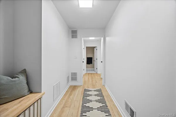 a view of a bedroom from a hallway