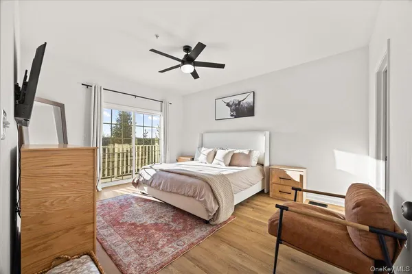 a bedroom with a bed and glass window