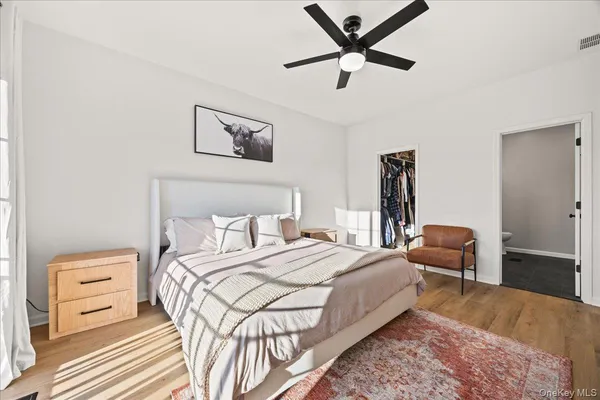 a bedroom with a bed and a chair