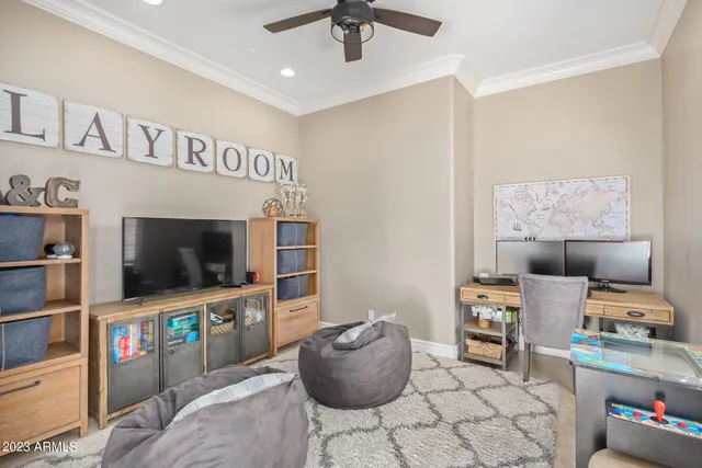 a living room with furniture kitchen view and a large window