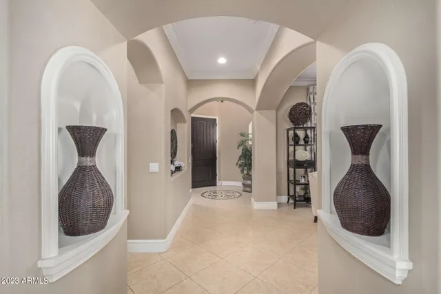 a living room with furniture and a ceiling fan