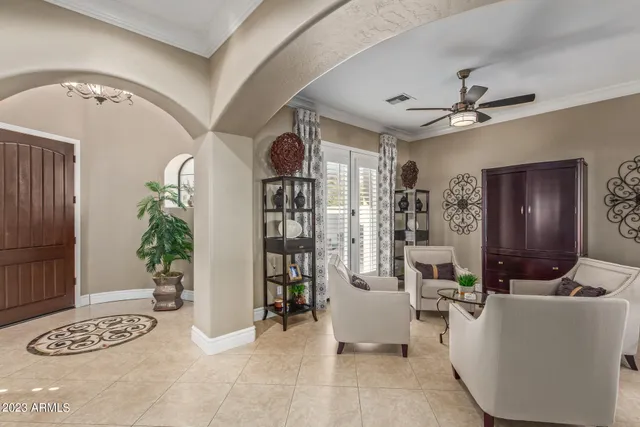 a living room with furniture and a potted plant
