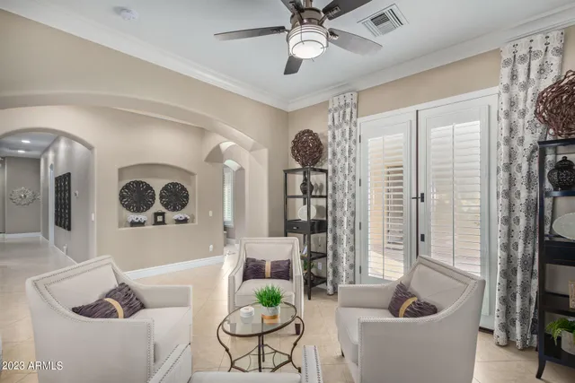 a spacious bedroom with a bed and a dresser